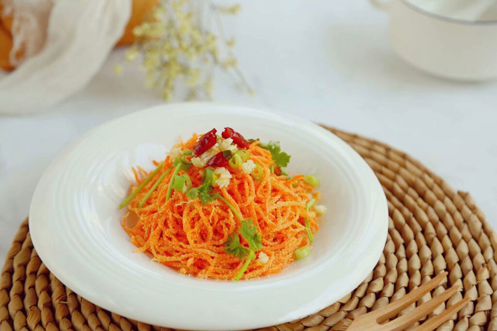 Steamed carrots with flour in a plate