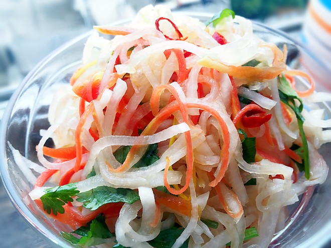 daikon radish salad shreds in a glass bowl