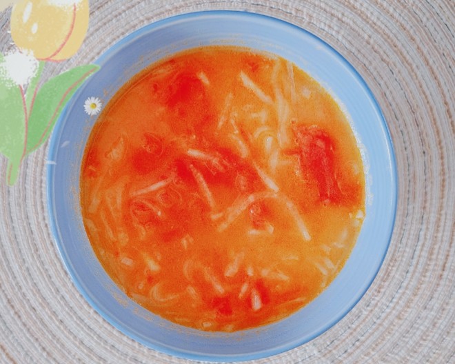 yellow and red daikon radish soup in a bowl