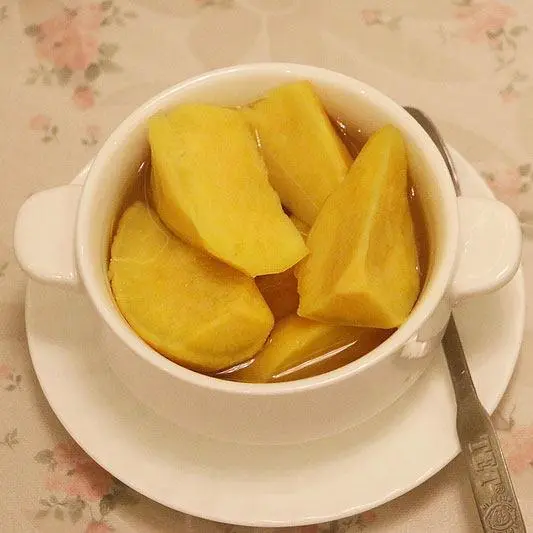 Sweet Potato sweet soup in a white bowl a spoon