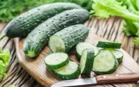 cucumber and cucumber pieces on table