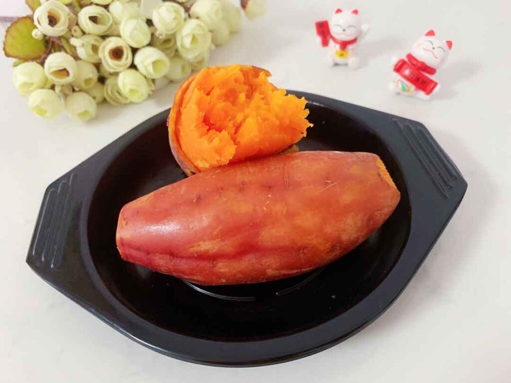 steamed sweet potato in a black bowl