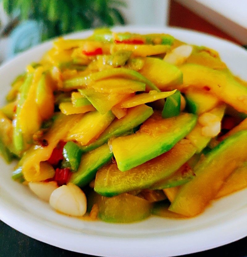 stir fried pumpkin pieces on a plate